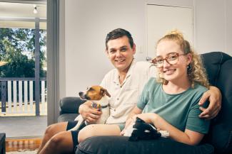 Jake and Annaleise on the couch with their Jack Russell dog