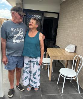 Neville and Isabel on their front porch